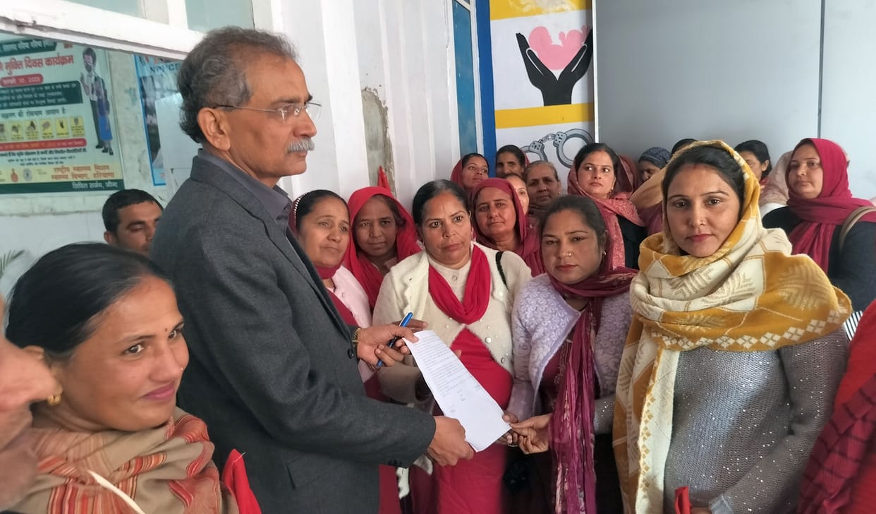 ASHA workers staged a protest at the civil hospital over their pending demands.
