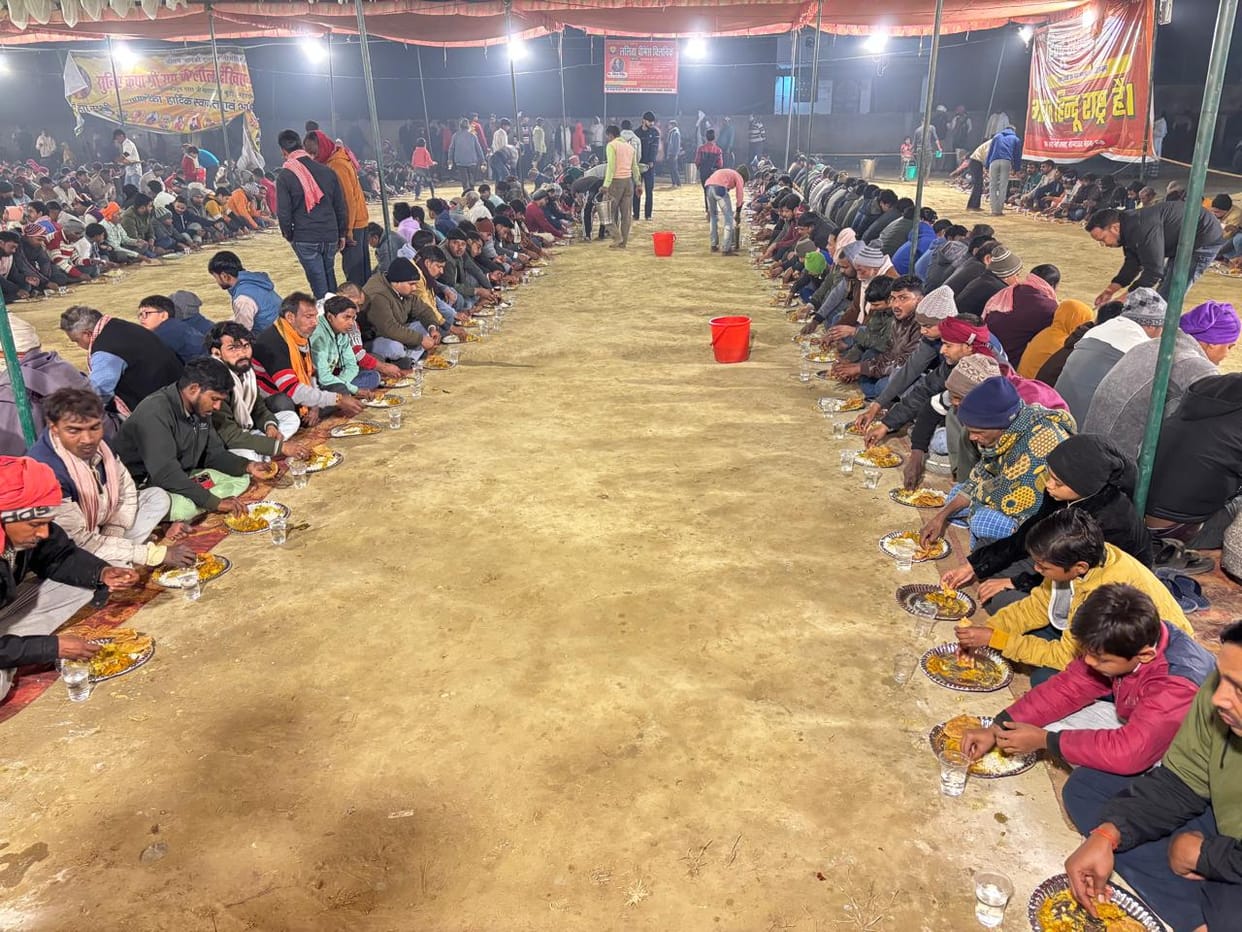 After the story, they received and ate the blessed food at the community feast.