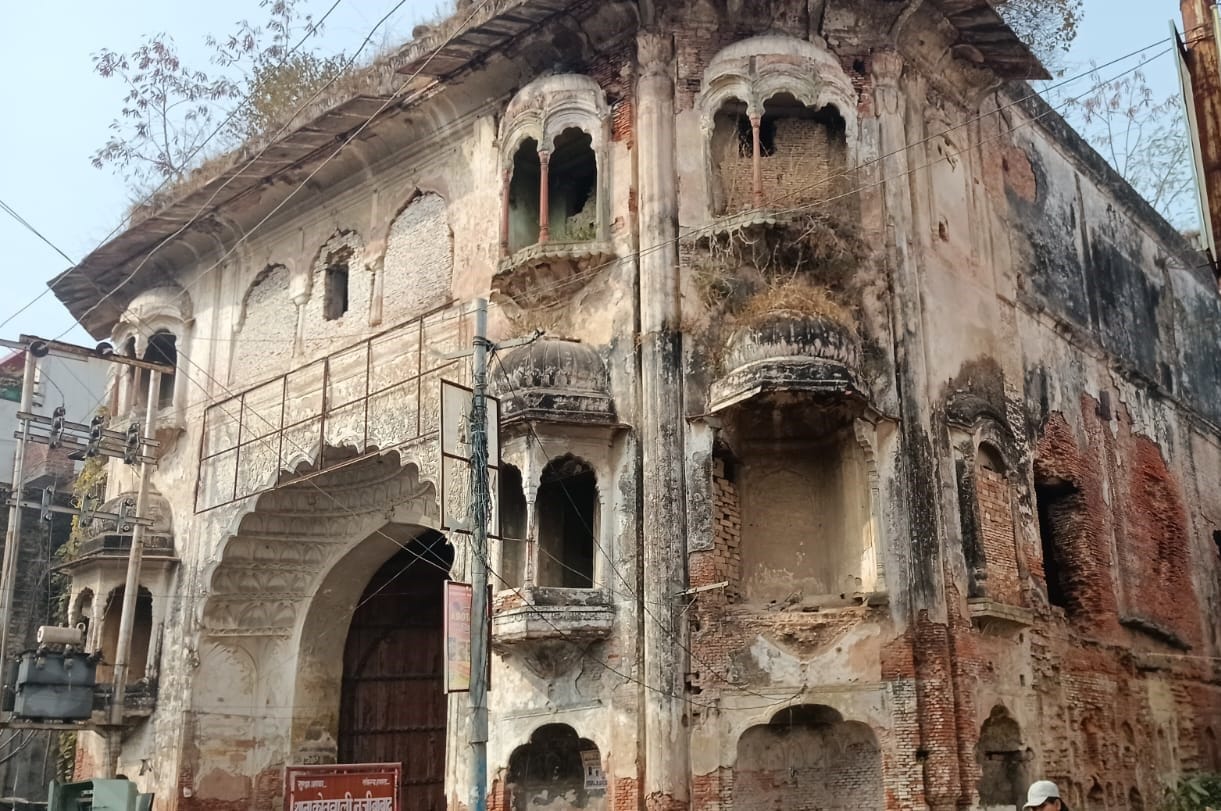 Repair work begins at the main gate of the Nawab's palace