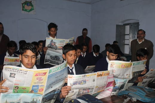 Students read newspapers, major news stories were read out in class.