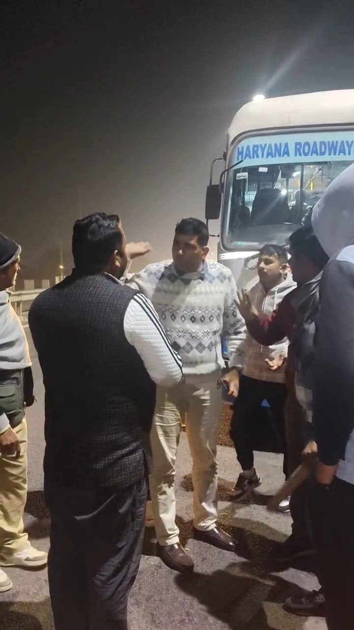 Villagers argue with the driver over the non-stop roadways bus stoppage