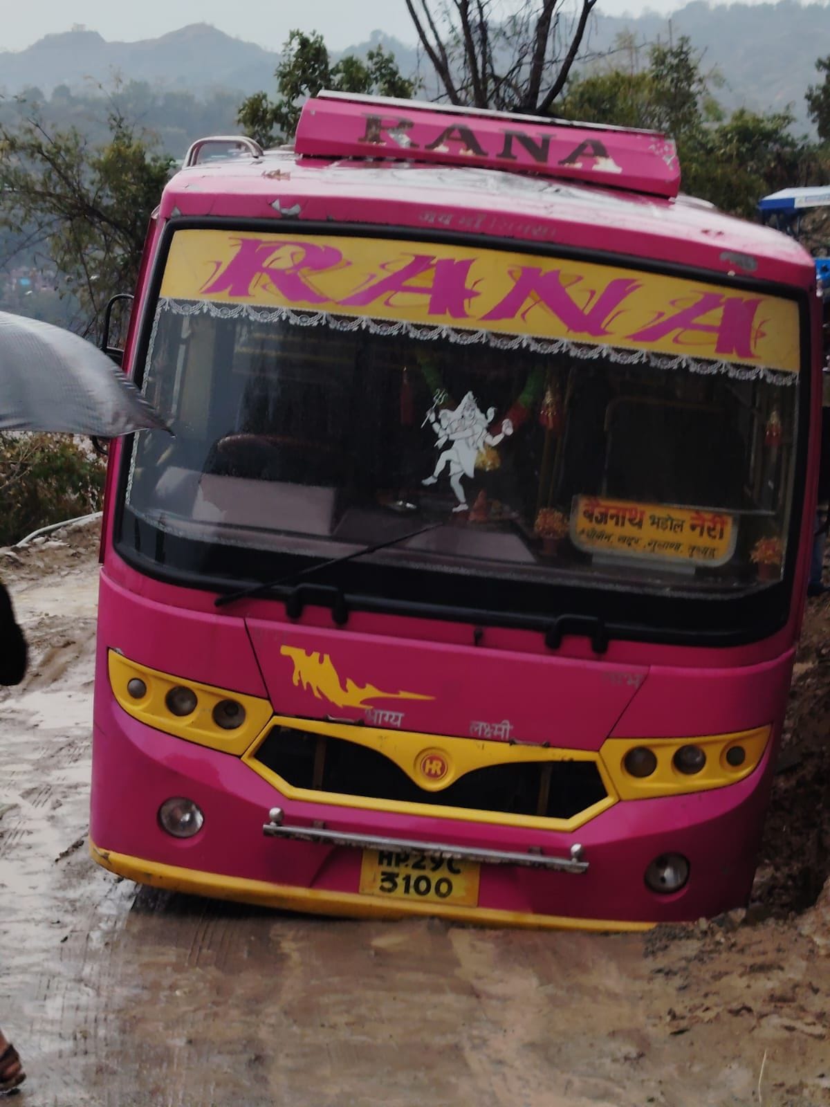 Private bus stuck in debris near Kothi