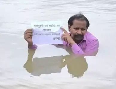 Protesting against the sale of Chinese kite string by standing in the river.