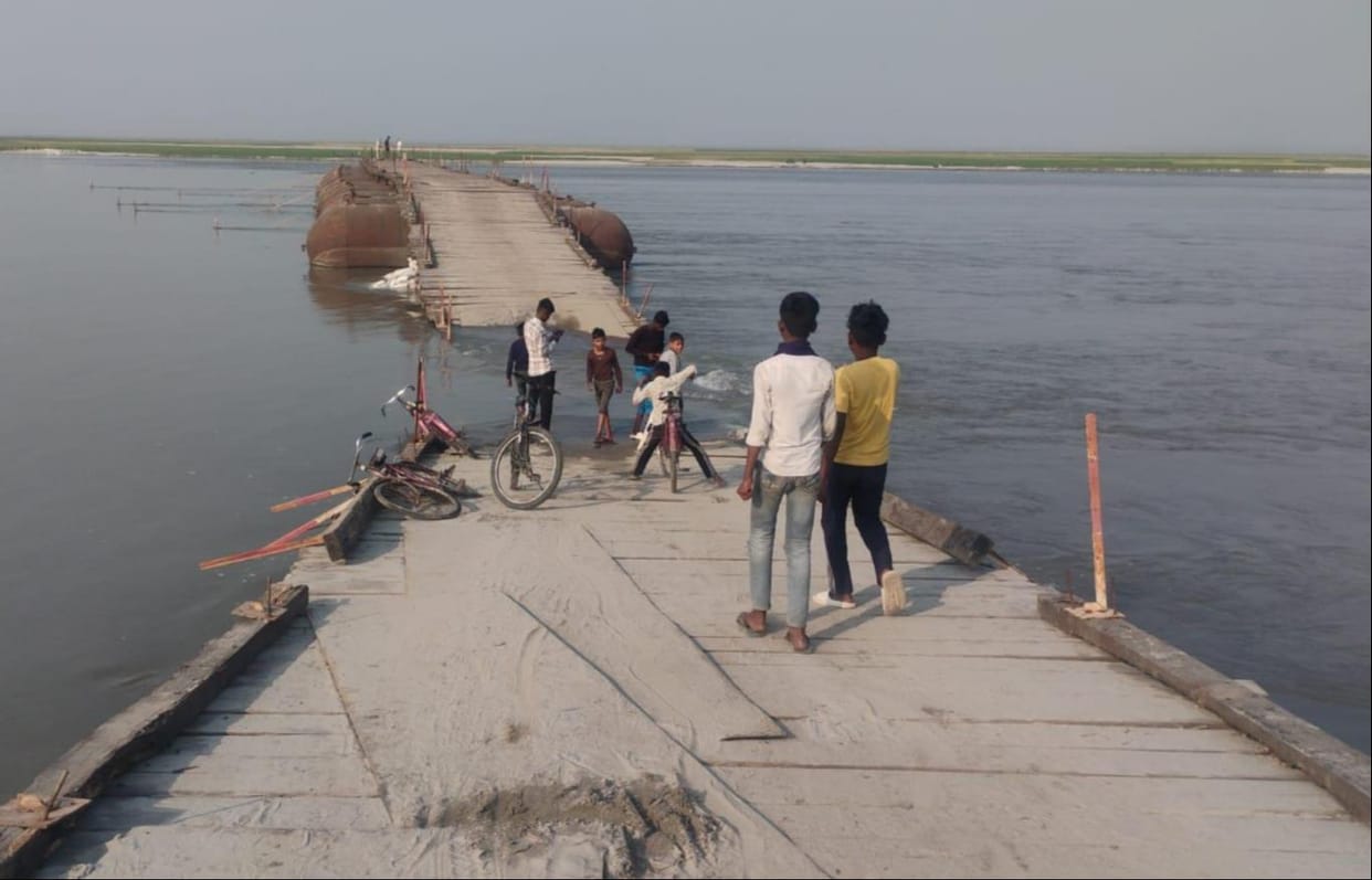 The approach to the pontoon bridge was washed away due to the rising water level of the Gandak river.