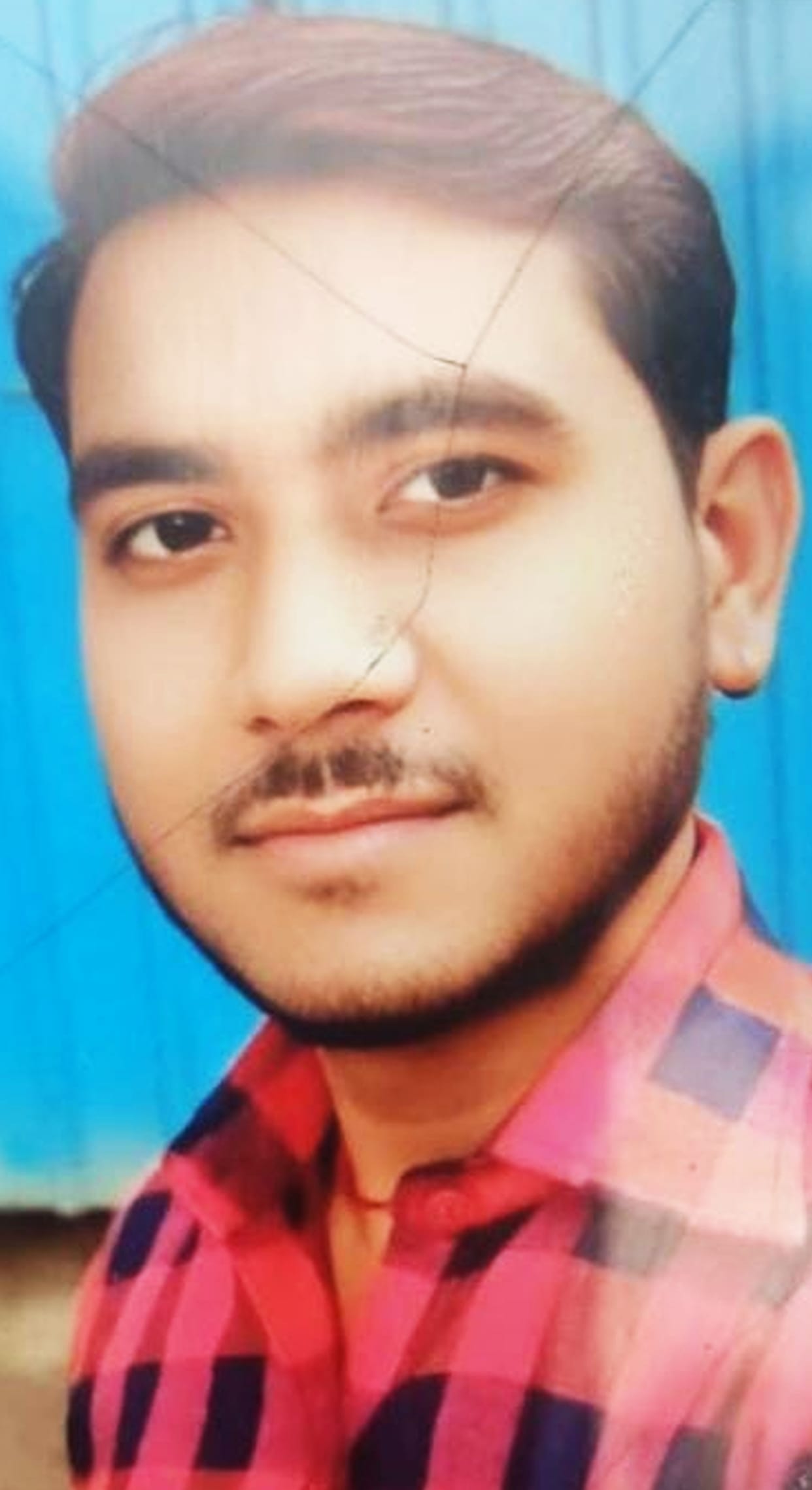 A young man who fell after a bike collision was crushed by a dumper loaded with gravel, resulting in his death.