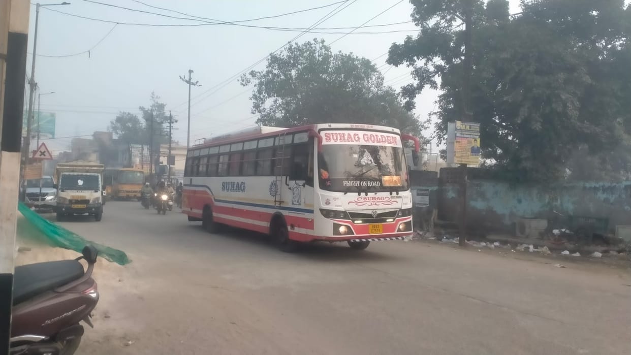 Bus traveling through the city, fined for traffic violation.