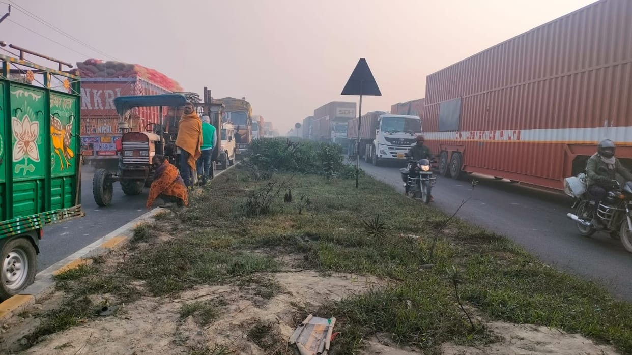 A trailer loaded with corn overturned on the highway, blocking one lane for five hours.
