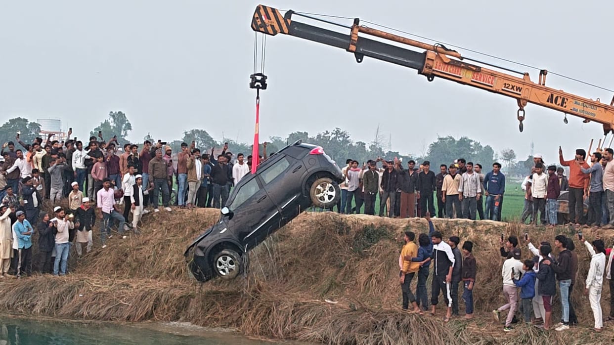A car fell into a canal while a reel was being made, and the occupants barely escaped.