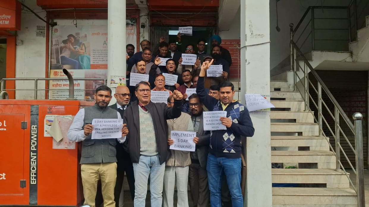 Banks remain locked, employees raise their fists