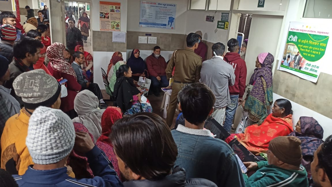 Crowd of patients in the district hospital, doctors missing from their seats