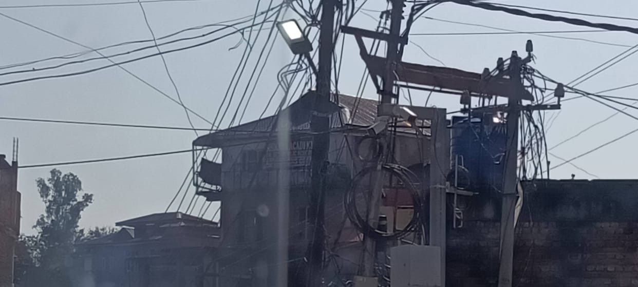 Ghumarwin's streetlights reflect the sun
