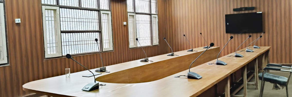 A well-equipped meeting hall is ready for the meeting of officials