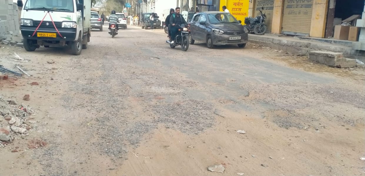 Pedestrians are forced to jolt due to potholes on the roads.