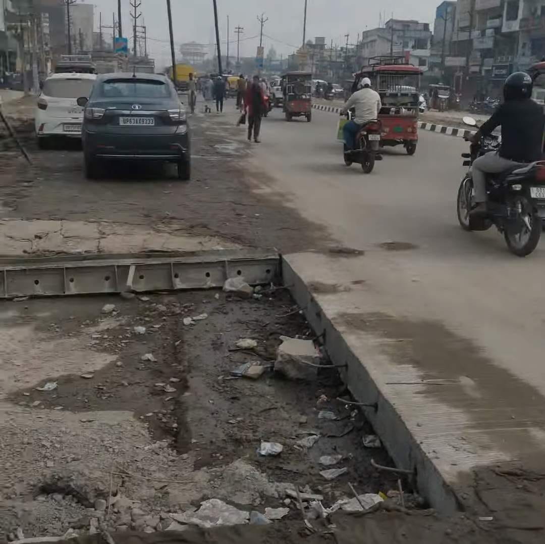 Road constructed without removing electric poles, potholes created at 10 places