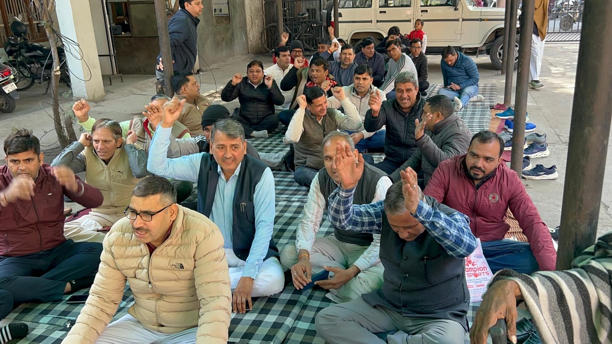 The association staged a sit-in to reinstate the six suspended Patwaris.
