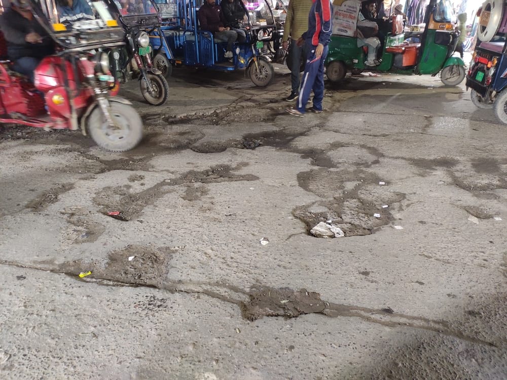 The social worker said, "Officials should get off their two-wheelers and see the reality of the roads for themselves."