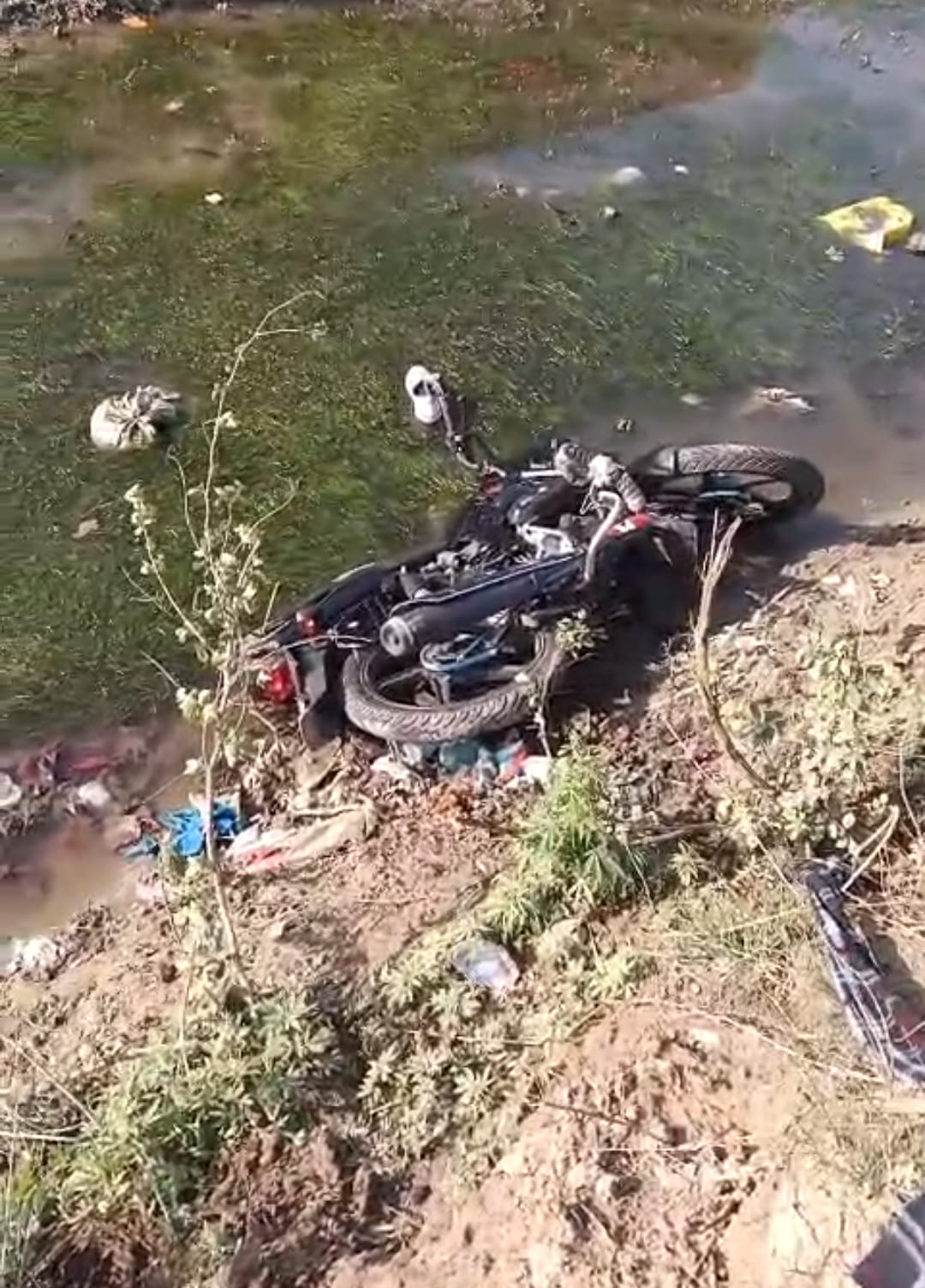 Car overturned after falling into drain, bike rider fell into canal