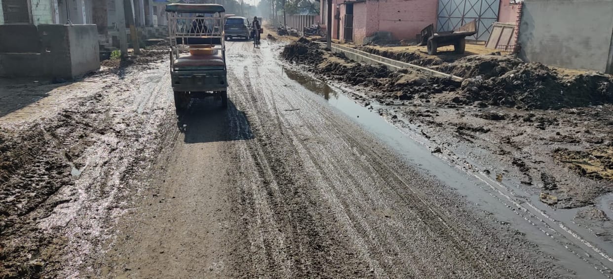 Drain construction stalled, main road flooded with contaminated water.
