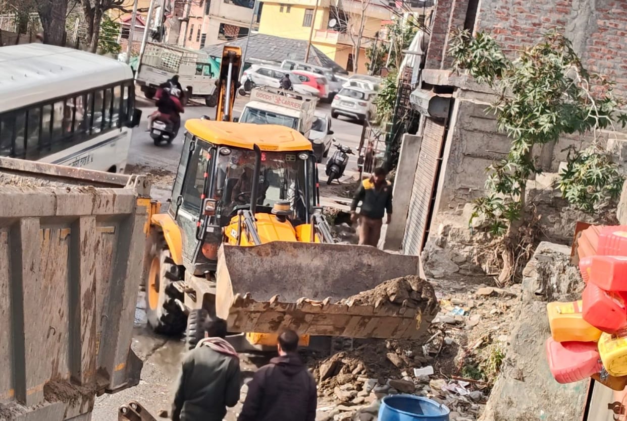 Potholes on the NH were filled with soil, which washed away in the rain and reached the drains.