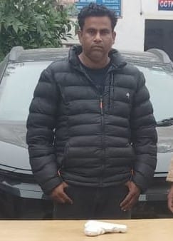 Police arrested a property dealer who was carrying an illegal pistol.