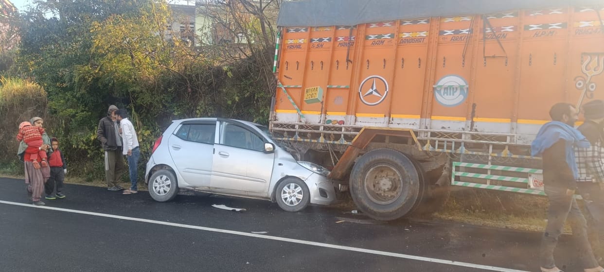 Car collides with truck parked on the roadside, two injured