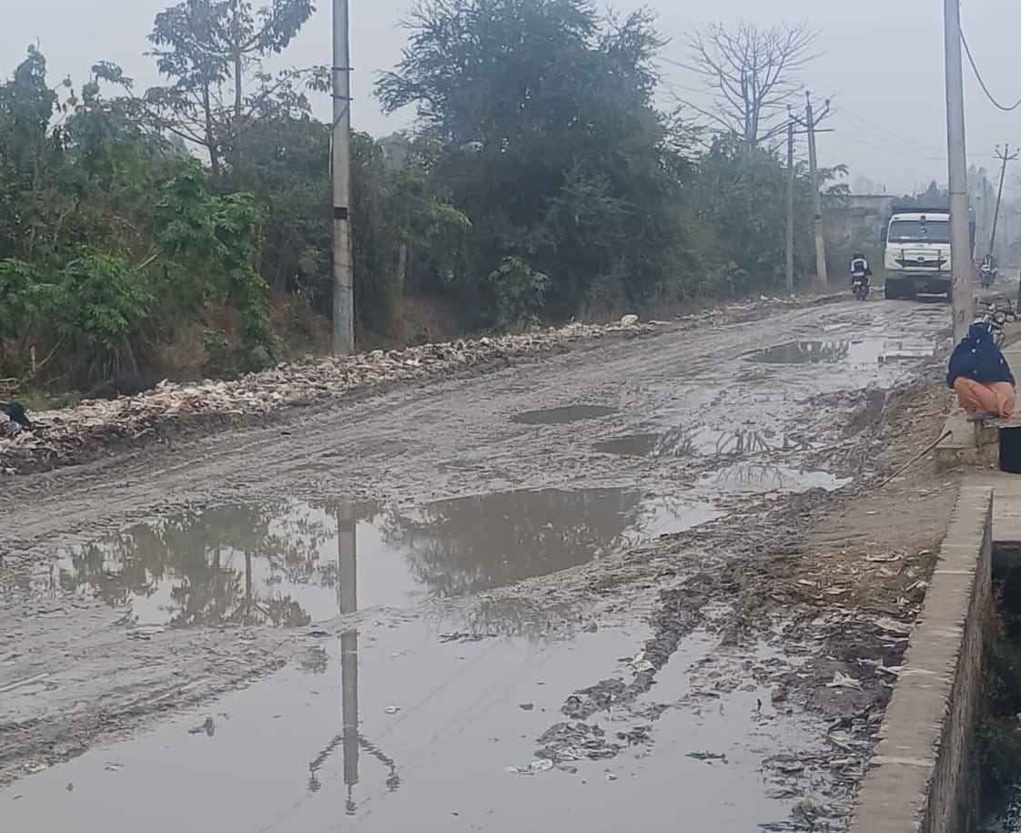 Waterlogging and mud on the road, causing problems for people in commuting