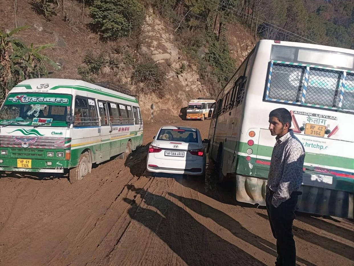Mud and potholes on the Mandi-Jahu road are increasing the difficulties for commuters.