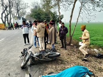 A mother and son riding a bike died after being hit by a bus full of wedding guests; angry family members blocked the road
