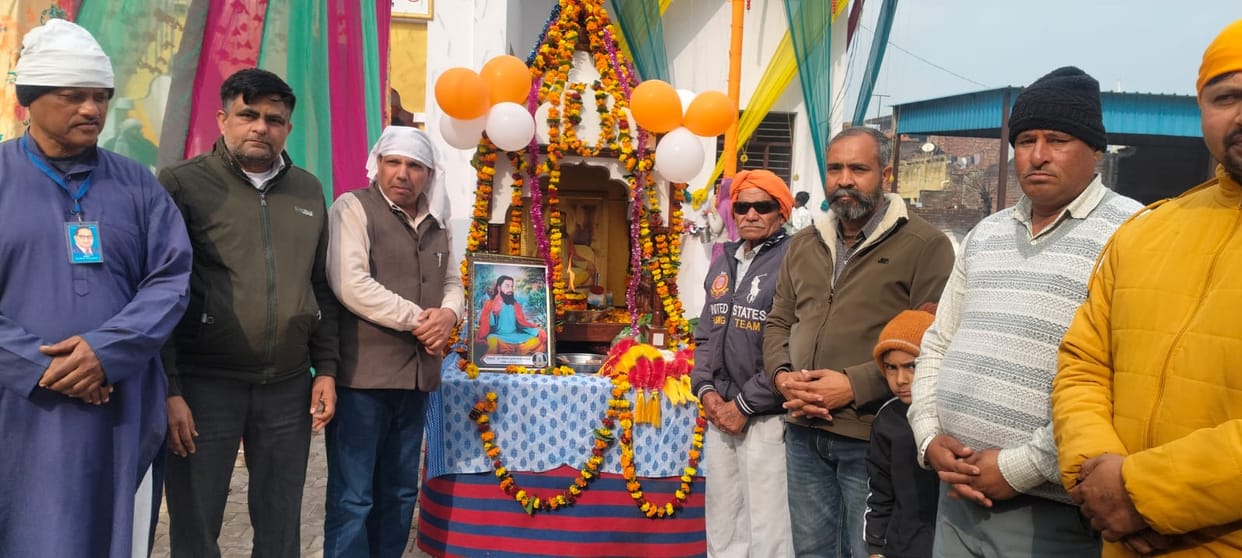 Paying homage to the statue of Guru Ravidas