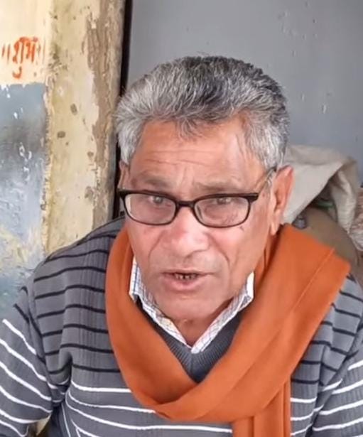 A grain trader was robbed of 50,000 rupees after being taken for a ride on a motorcycle.