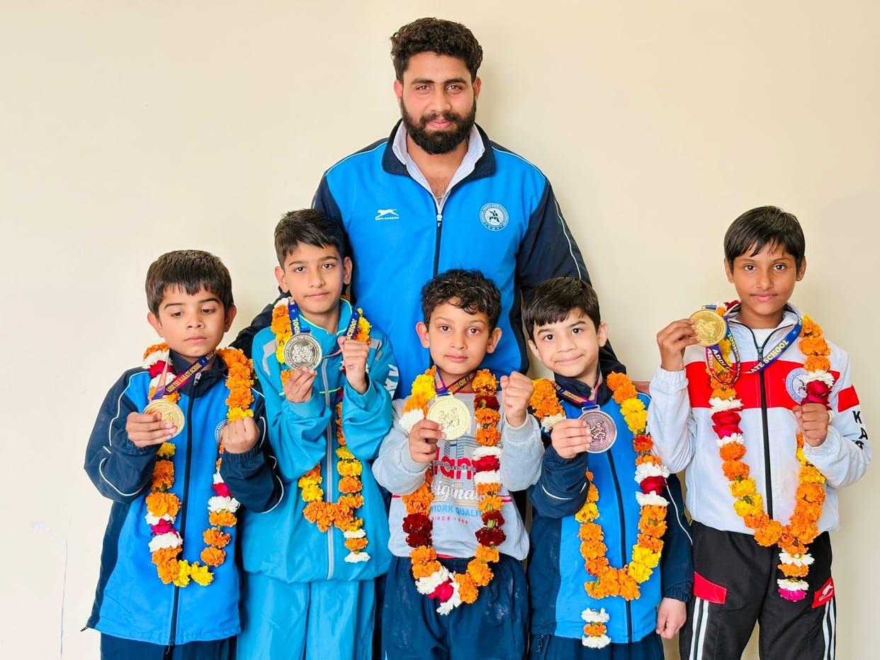 Players won medals in the karate championship.
