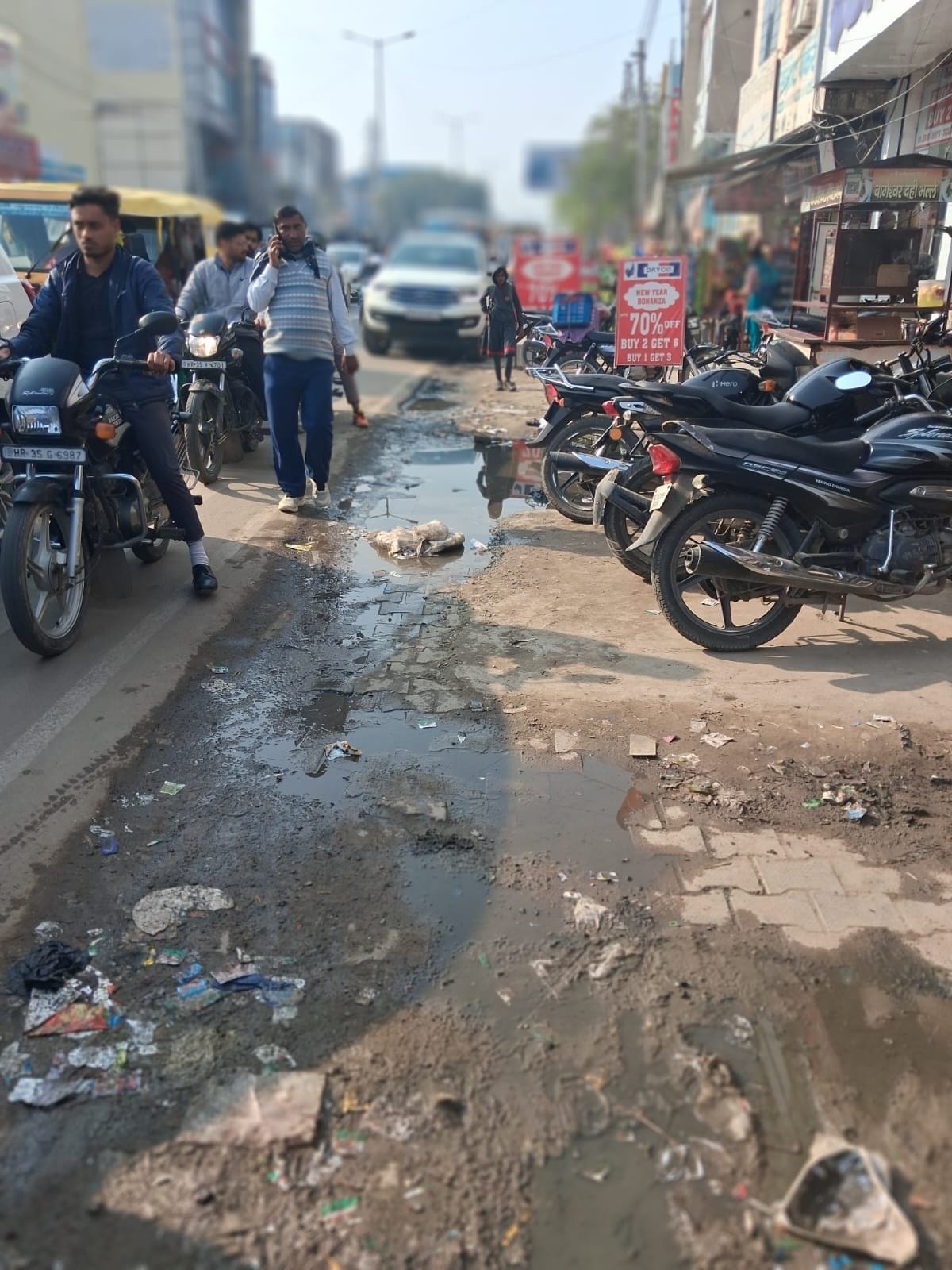 For the past two months, the sewer has been overflowing at Mahavir Chowk, and the road is filled with dirty water.
