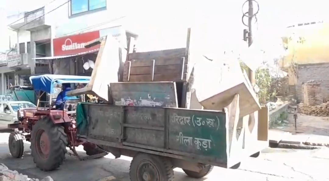 Officials took to the streets with a JCB machine to take action against encroachments