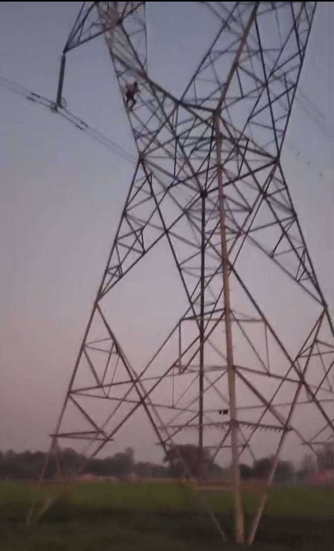 A young man, upset by his wife leaving him, climbed onto a high-tension power line tower