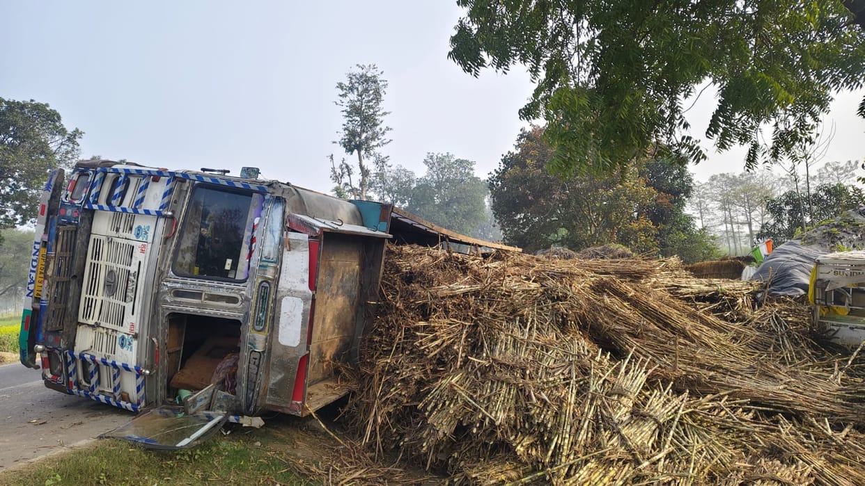 Overloaded sugarcane truck overturns on hut, family has narrow escape