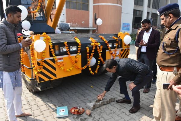 DC and SP break coconuts by giving hydraulic crane to traffic police
