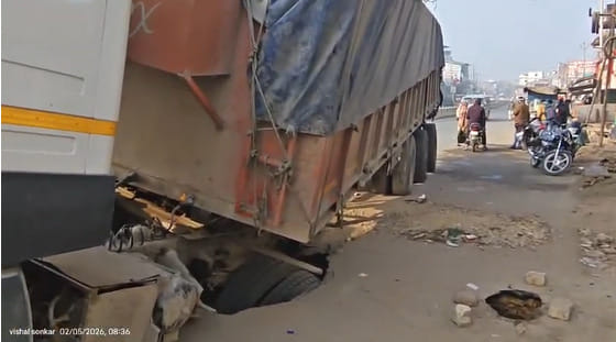 The road, built two and a half years ago after the sewerage was laid, caved in at two places, and a truck got stuck in a pothole.