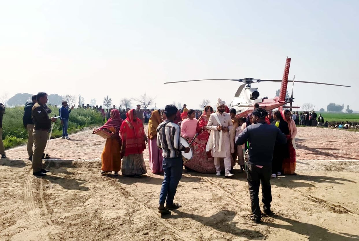 The engineer groom arrived in Sundernagar village by helicopter to pick up his bride.