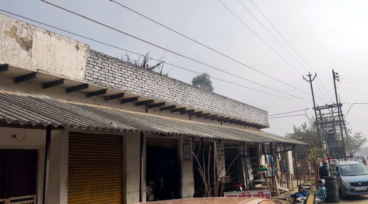 High-tension wires hang from the rooftops in Sallahpur village.