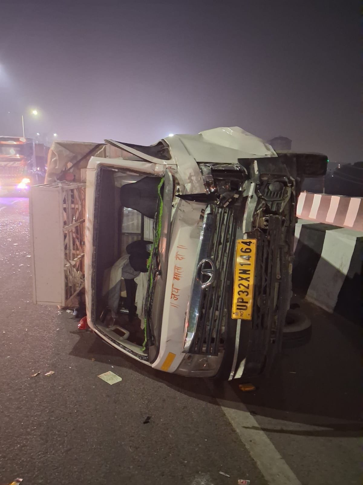 A dumper overturned after colliding with a car, with the driver slightly injured