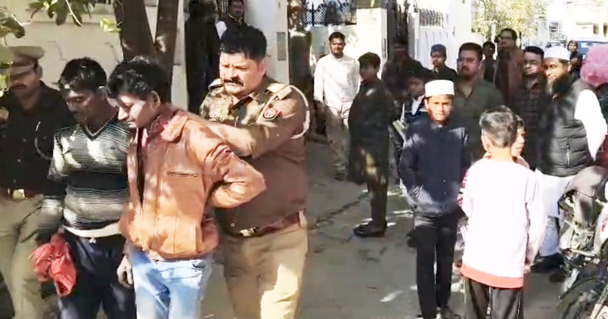 Two youths were caught and beaten by a mob while stealing from a house.