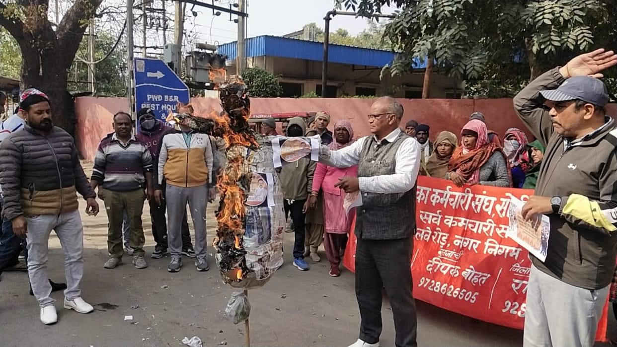 Employees burnt an effigy in protest against the minister's statement.
