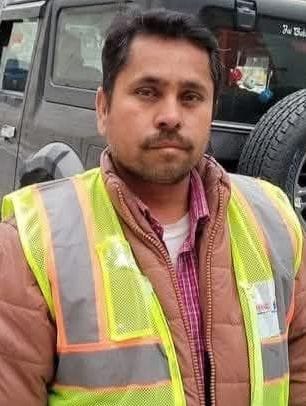 An employee died after being hit by stones falling from a hill.