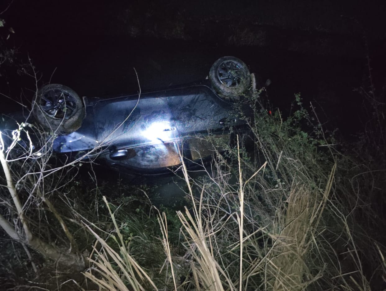 The car returning from Tilak lost control and overturned.