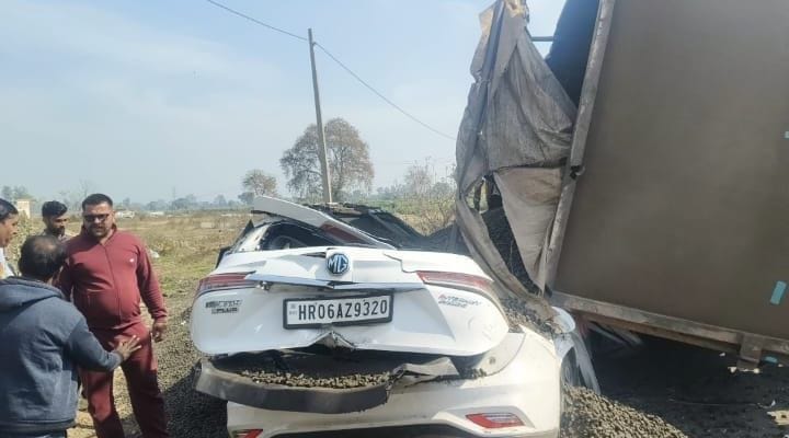 A truck loaded with gravel overturned onto the bride and groom's car; they narrowly escaped unharmed.