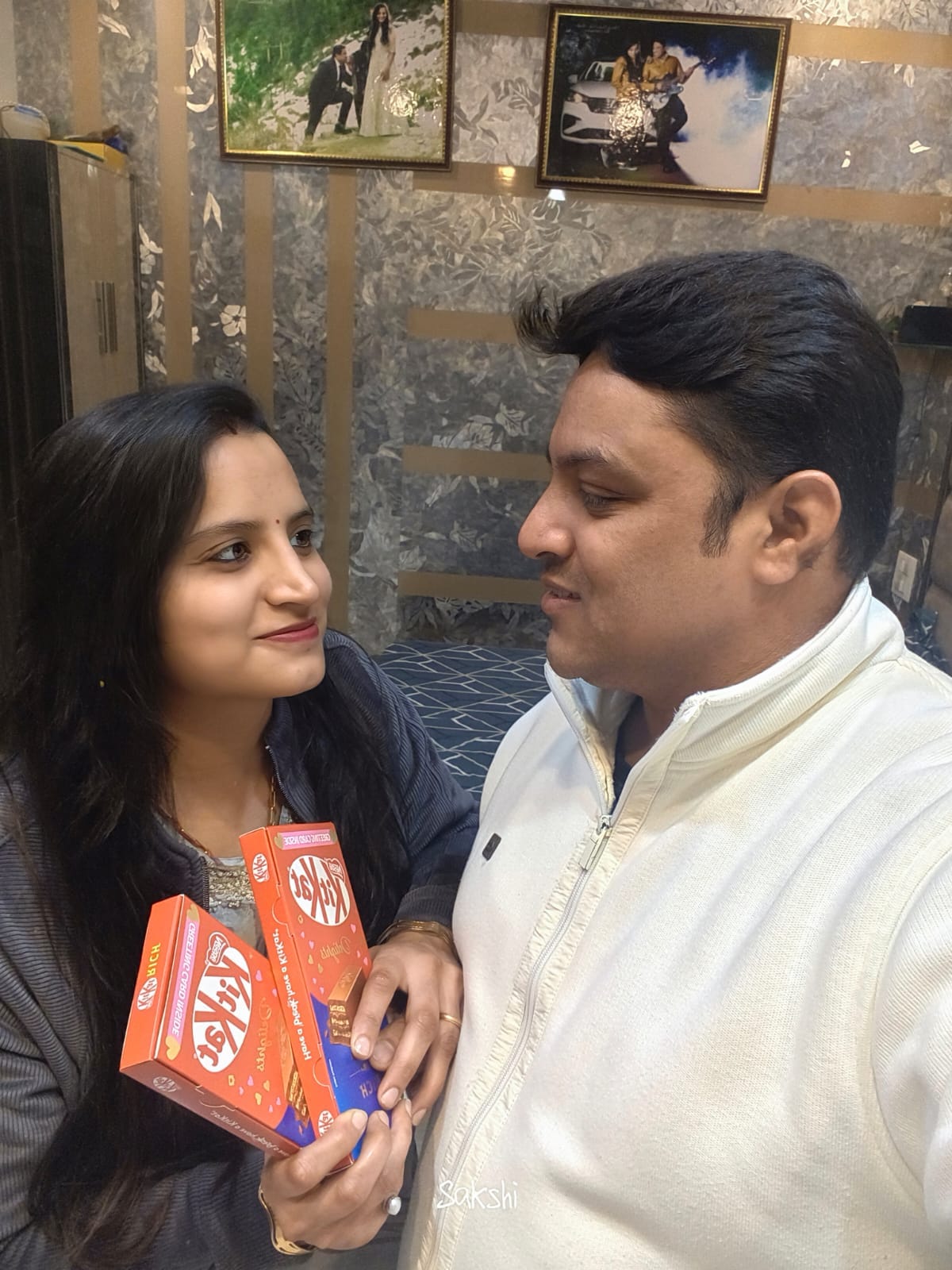 Husband and wife sweeten their relationship by giving chocolate to each other