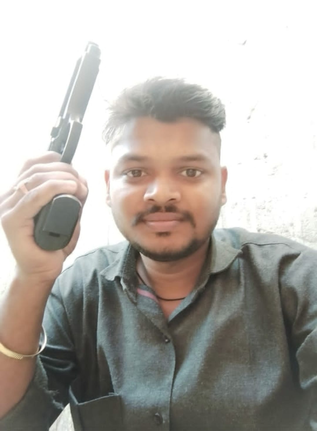 Photo of young man with pistol goes viral