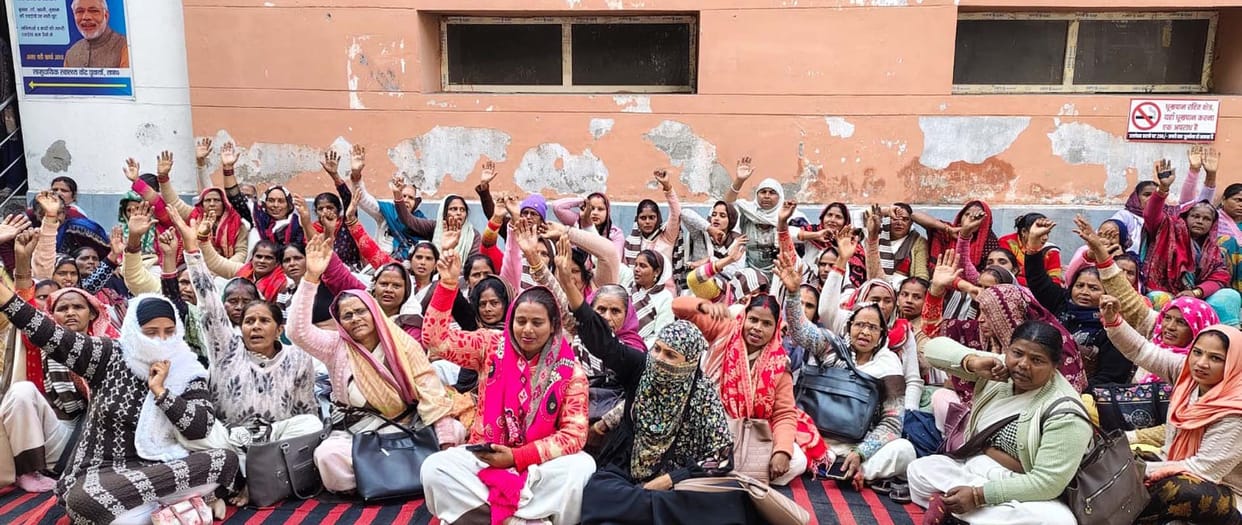 Asha workers protested by wearing black bands.