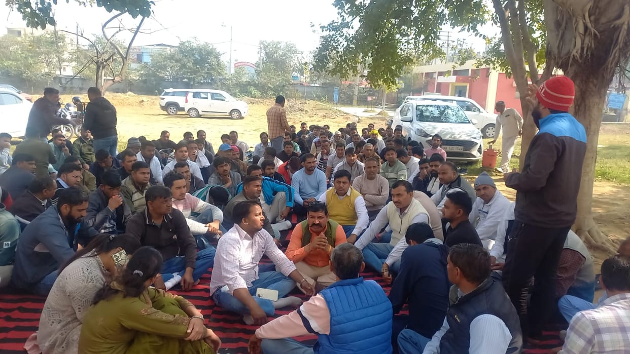 Electricity employees staged a sit-in protest against the transfer.