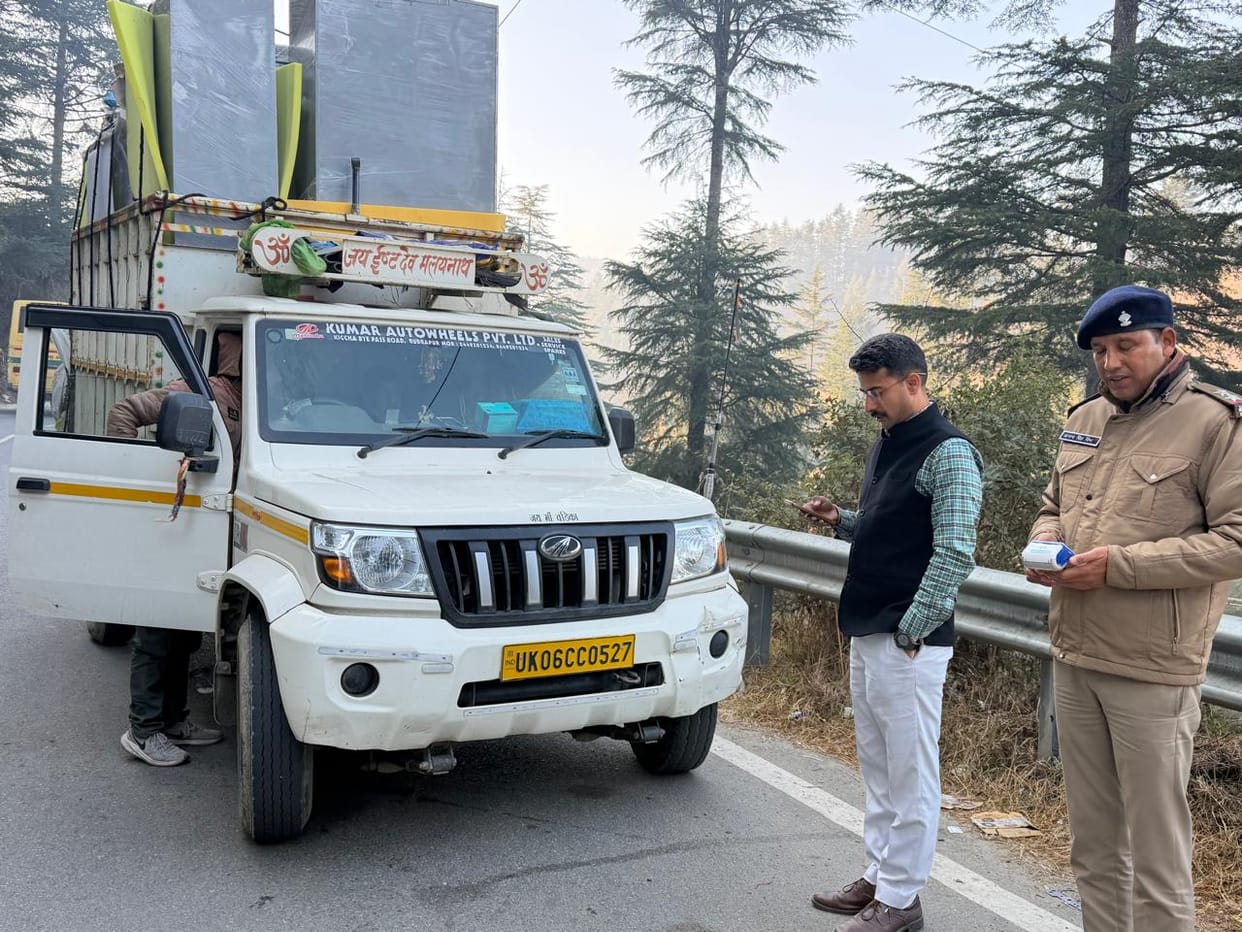 Two vehicles, including a school bus, were seized for violating traffic rules and a challan of Rs 215 was issued.